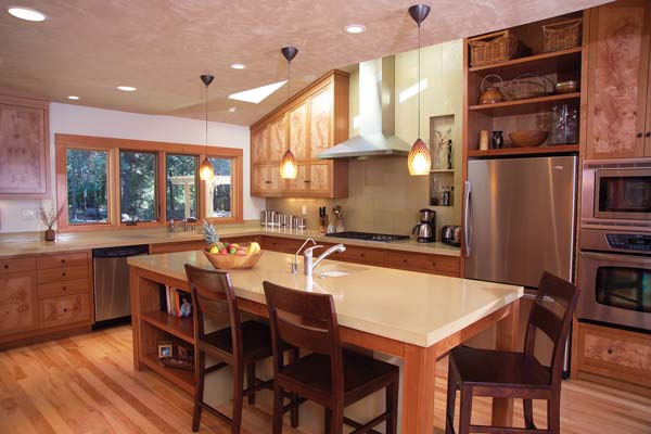 
Operable kitchen skylights release hot air in summer. Three-quarters of the cherry used for the kitchen cabinetry is Forest Stewardship Council-certified.
